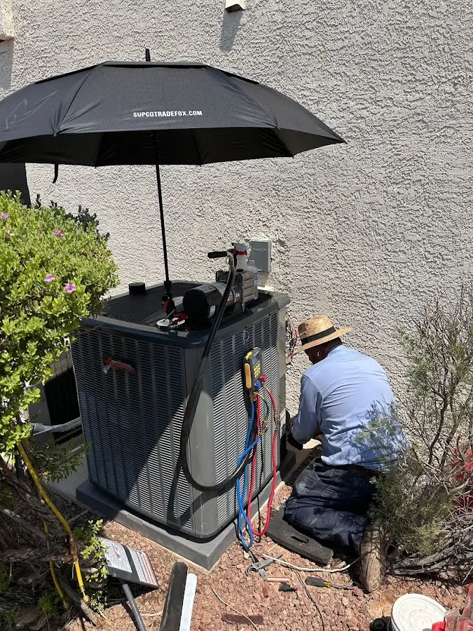 HVAC technician performing outdoor AC maintenance in Brushy Creek